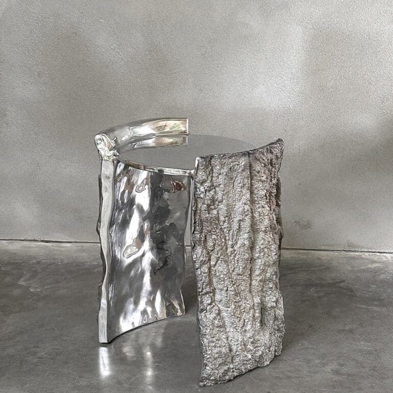 cast aluminium stool with bark textured exterior and Mirror polished aluminium top and interior
